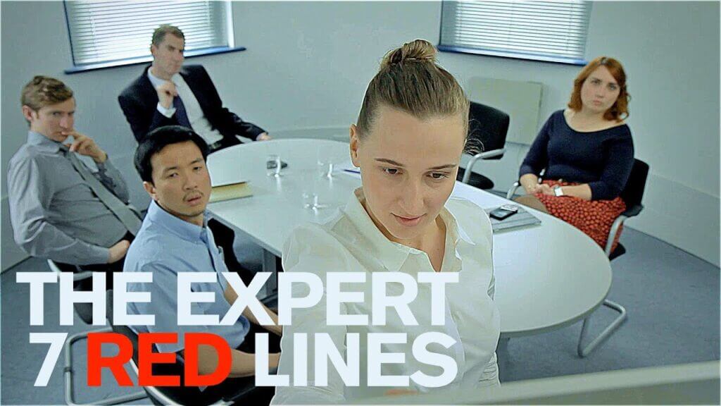 5 people sitting in an office meeting in the short film the expert on special cine