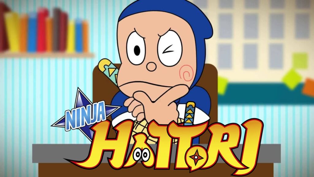 ninja hattori sitting on a desk thinking