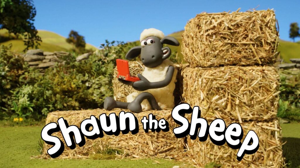 shaun the sheep sitting on hay stacks playing games and smiling under a clear sky